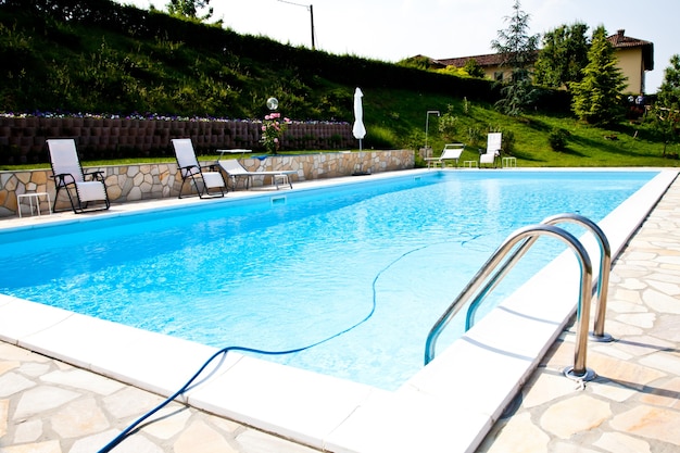 Swimming pool of an Italian beauty farm in the middle vineyards, Monferrato area, Piemonte region.