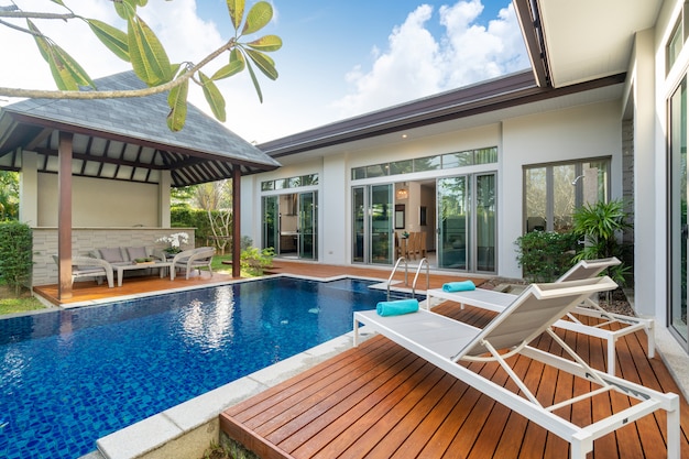 Swimming pool and pavilion with green garden