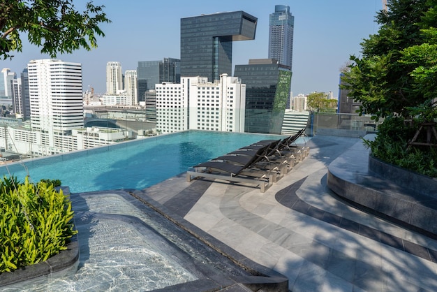 Swimming Pool on roof top of Condominium or Swimming of Hotel Coastline Beautiful Roof building skyscrapers view Pool of hotel concept Summer luxury skyscrapers pool