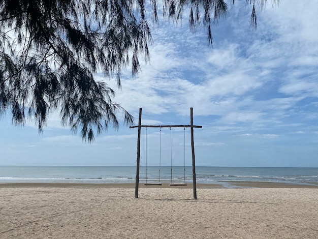 Swing on beach view background