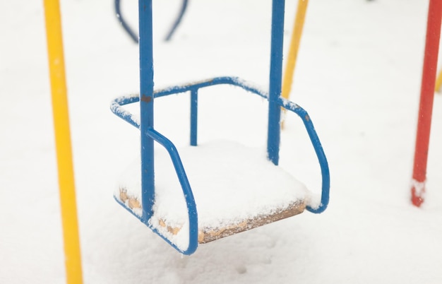 Swing in the snow Playground in winter