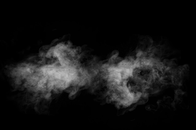 Swirling wriggling smoke steam isolated on a black background for overlaying on your photos Fragment of horizontal steam