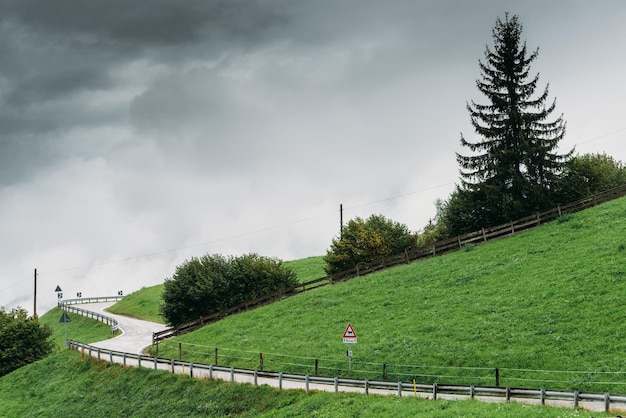 Swirving dangerous road on a hill during wet and bad weather conditions