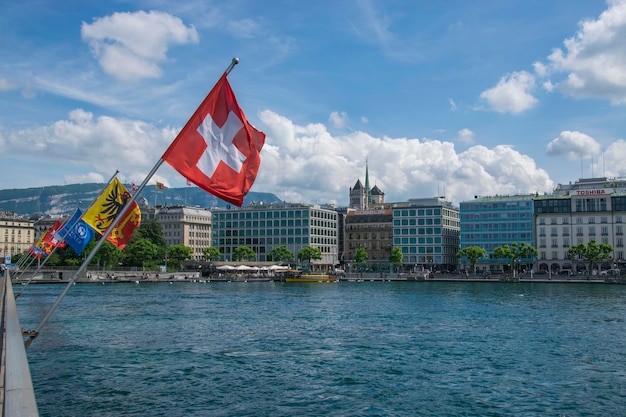 Swiss flags on the bridge in the city center of Geneva Switzerland