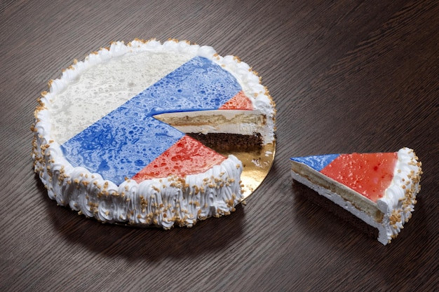 The symbol of war and separatism a cake with a picture of the flag of Russia is broken into pieces