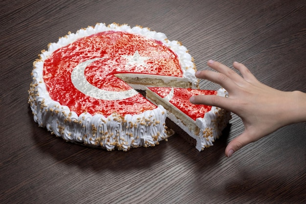 The symbol of war and separatism a cake with a picture of the flag of Turkey is broken into pieces