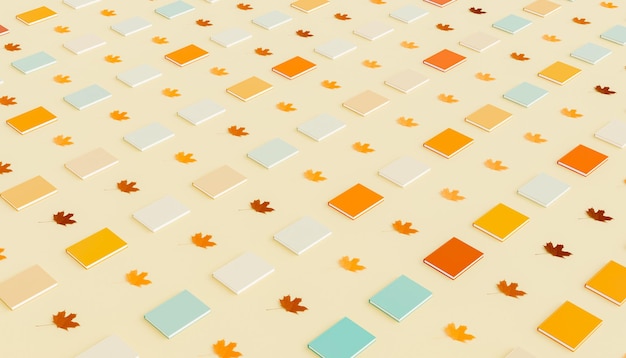 Symmetric rows of colorful books and dry maple leaves on surface