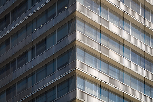 Symmetrical view of the corner of a residential building covered with a mesh