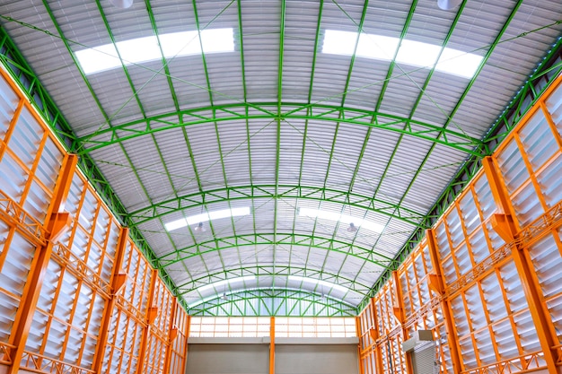 Symmetry view of aluminum louver wall with metal roof structure inside of industrial building