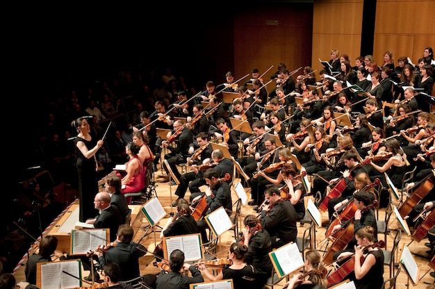 Symphonic orchestra performing on stage