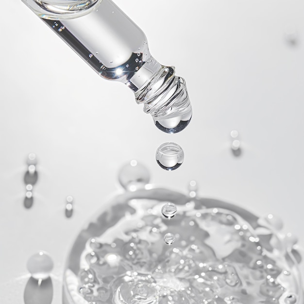 a syringe being poured into a glass container