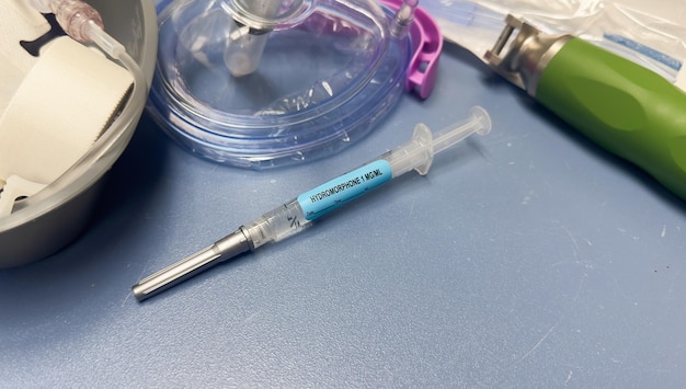 A syringe with a blue label that says'syringe e. g. '