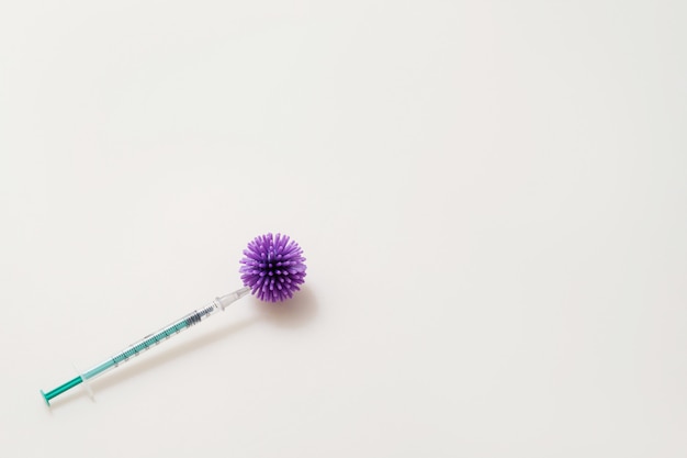 Syringes on the table with bacteria of coronavirus, bacterium injection