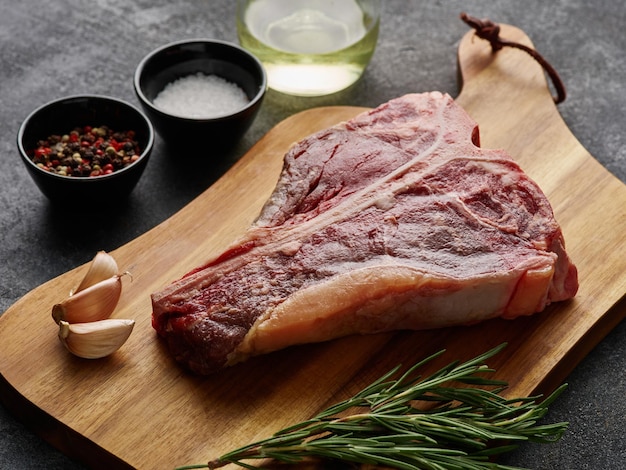 T-bone or porterhouse raw steak of beef cut from the short loin Steak include Tshaped bone