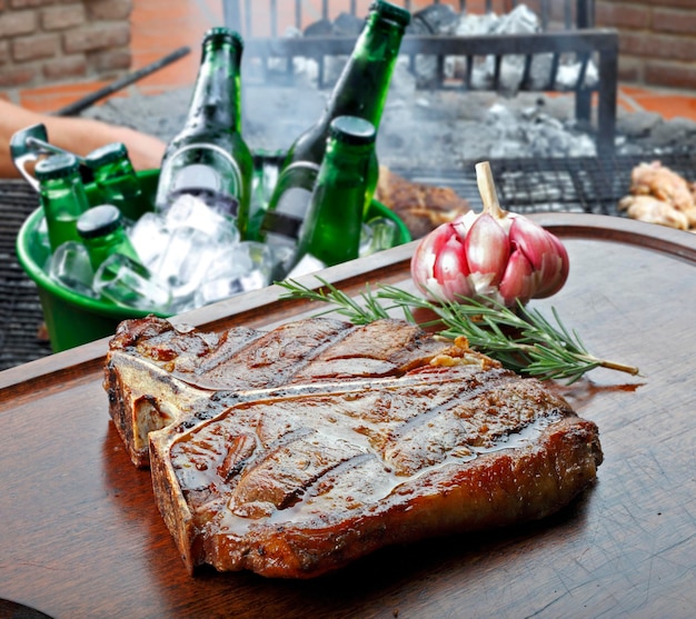 T bone steak with trimmings potato salad orange juice bread