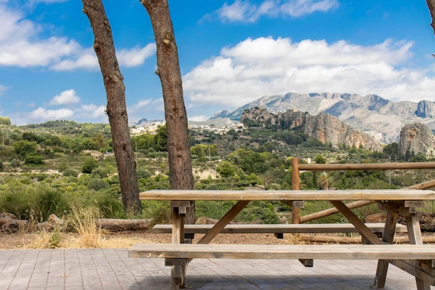 A table and a bench on a mountain lookout