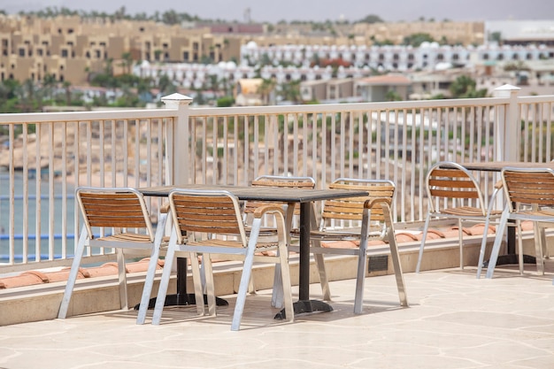 Table and chairs in beach cafe next to the red sea in Sharm el Sheikh, Egypt, close up