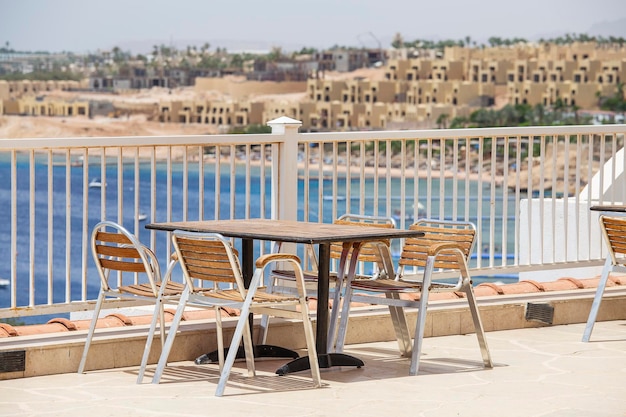 Table and chairs in beach cafe next to the red sea in Sharm el Sheikh Egypt