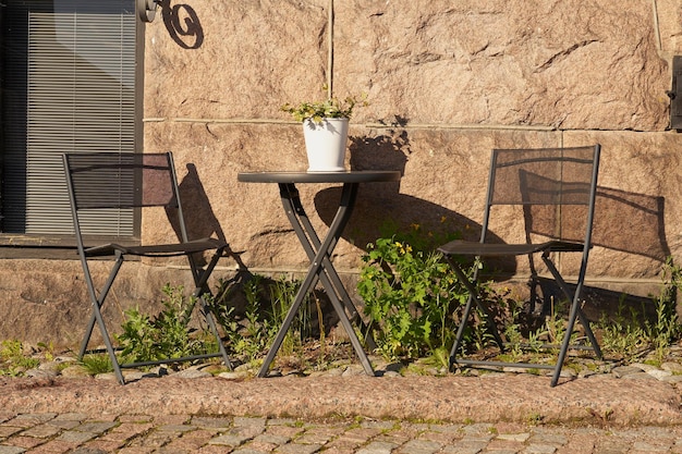 Table and chairs outside the cafe