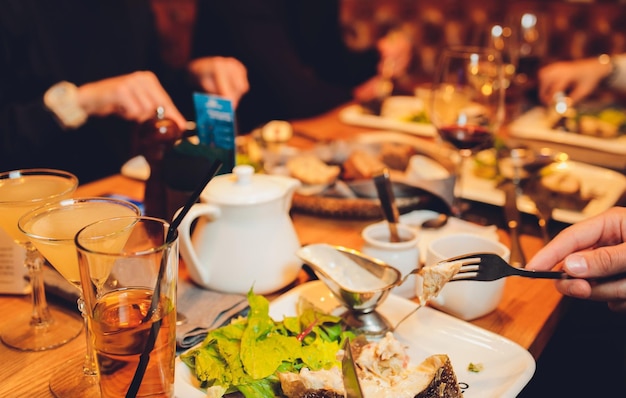 Table of enjoying food with family and friends top view