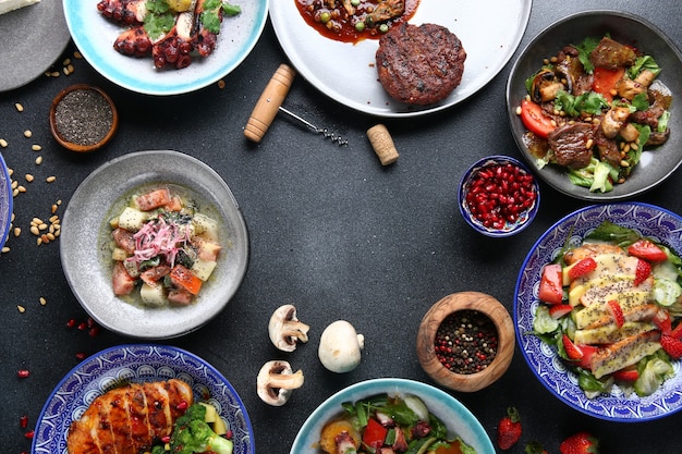 Table food top view. Set of dishes on the table. international mix set foods. vegeterian and meat and raw.