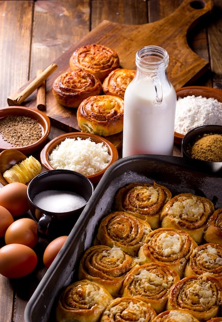 Table full of ingredients for the preparation of cinnamon rolls  desserts typical in Venezuela