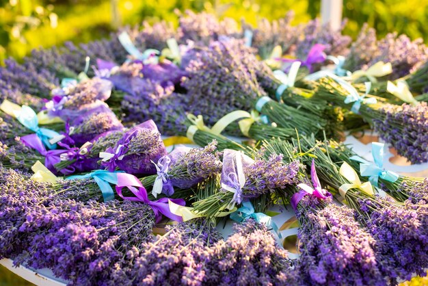 Table full of ready bouquets and sachets made of lavender