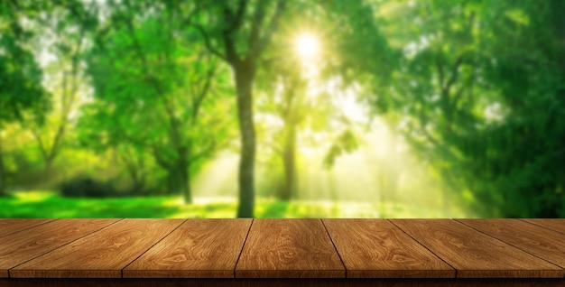 Table in green blur nature with empty copy space on the table for product display mockup