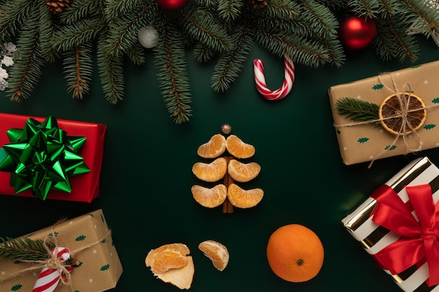 On the table is a Christmas tree made of tangerine slices