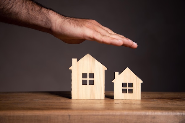 On the table is a model of wooden houses