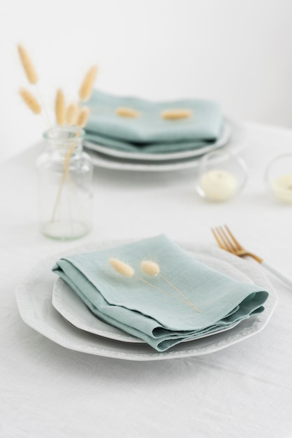 Table linens decoration with green linen napkins