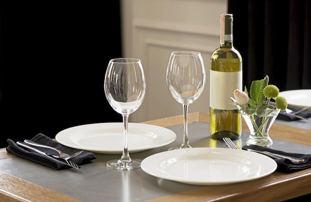 The table in the restaurant is served with white dishes