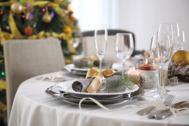 Table served for Christmas dinner in living room, close up view