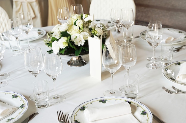 Table set for an event party or wedding reception. Beautiful table setting.