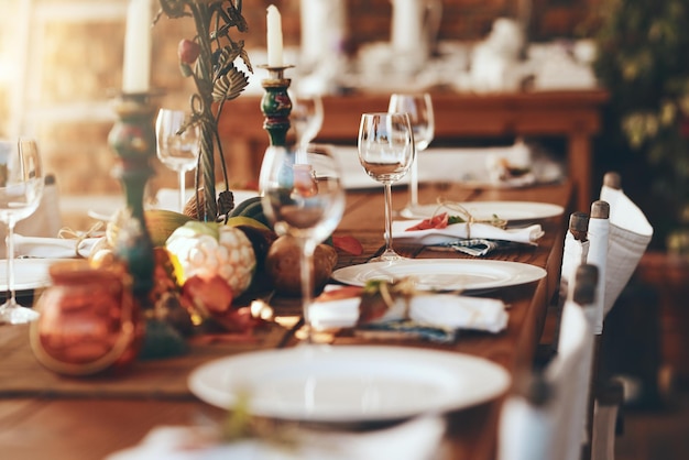 Table setting fine dining and celebration of Christmas dinner on a patio of a house Food party and dining table ready for a feast Thanksgiving tradition and dinner party with place setting