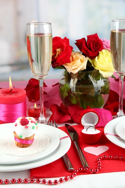 Table setting in honor of Valentine's Day on room background