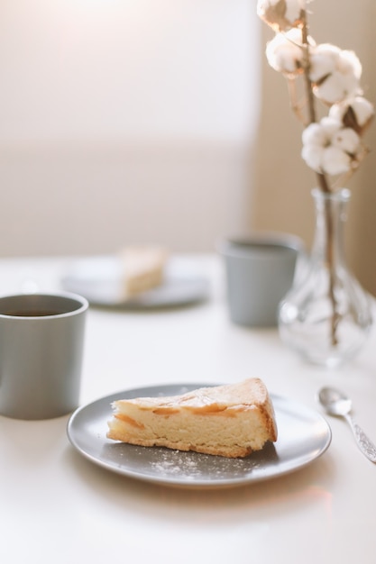 Table top photo of breakfast with coffee and cake