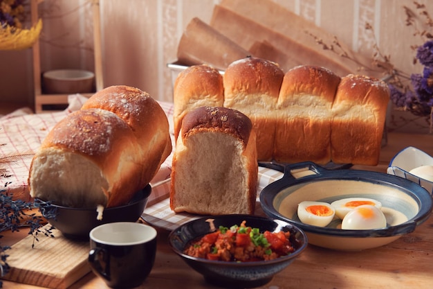 A table with bread and eggs on it