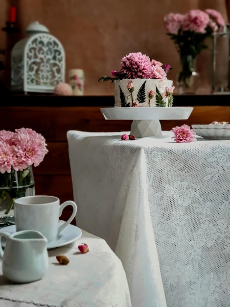 A table with a cake on it and a cake on it