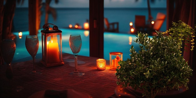 A table with a candle and a pool in the background