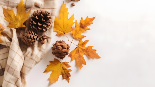 A table with a cloth, a leaf, and a few pine cones on it.