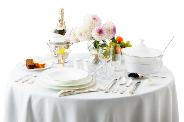 Table with dishes and flowers