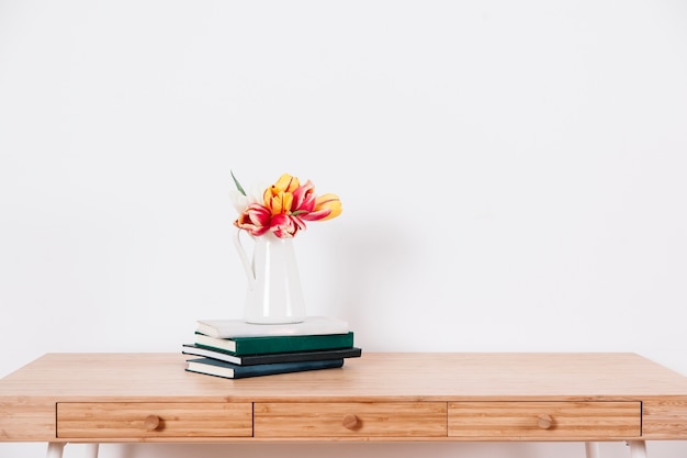 Table with flowers and notepads