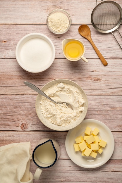 A table with ingredients for a cheesecake