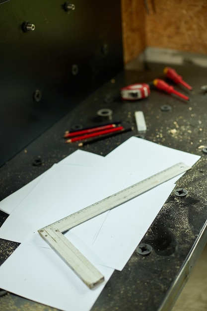 Table with paper pencil ruler architect draws plan of new apartment design at workshop