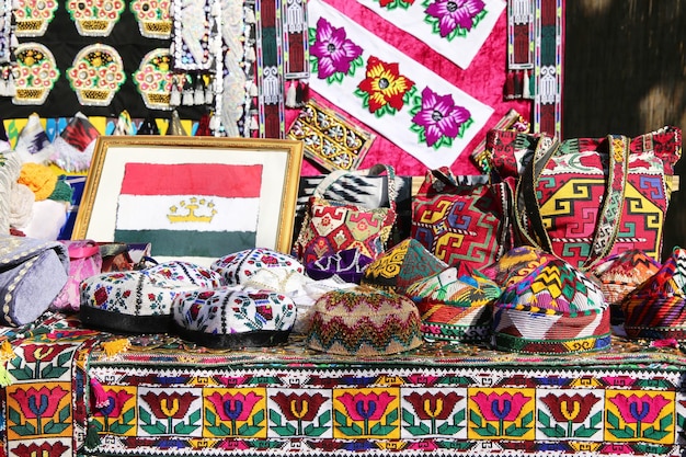 A table with a picture of a flag and a pillow with the word zapotec on it.