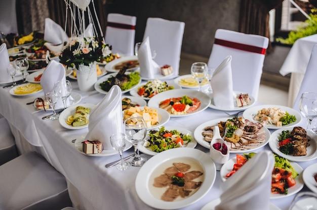 Table with silver and glass stemware at restaurant before starting to celebrate a wedding