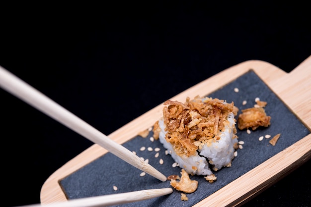 Table with sushi and chopsticks