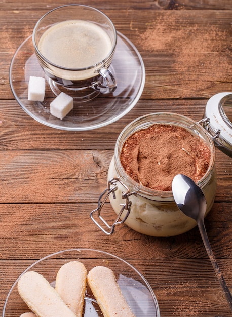 Table with tiramisu, pastry, espresso