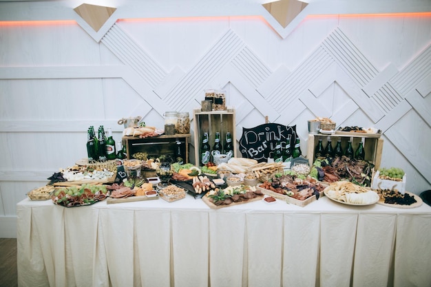 Table with traditional cold meat snacks at the wedding ceremony Catering service